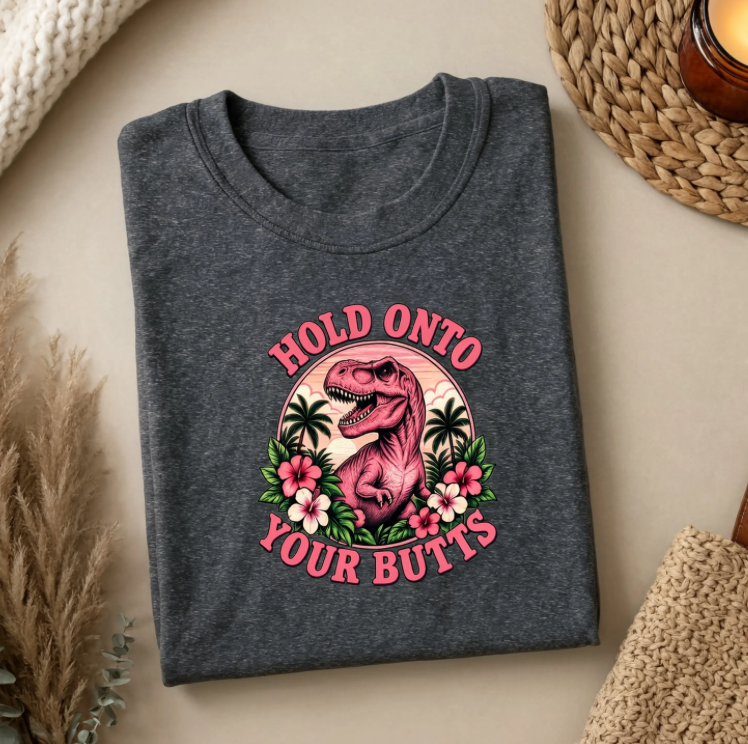 Hold Onto Your Butts Retro T-Rex Graphic Tee | Funny Dinosaur Tropical Shirt