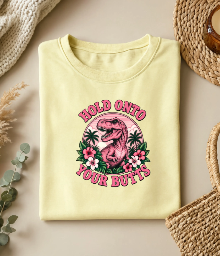 Hold Onto Your Butts Retro T-Rex Graphic Tee | Funny Dinosaur Tropical Shirt