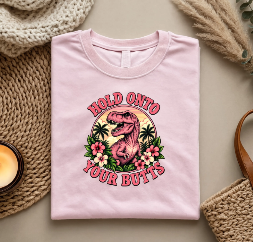Hold Onto Your Butts Retro T-Rex Graphic Tee | Funny Dinosaur Tropical Shirt